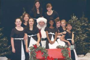 Members of the Stockton Concert Choir and Joan Calonico pose with Santa in 2014